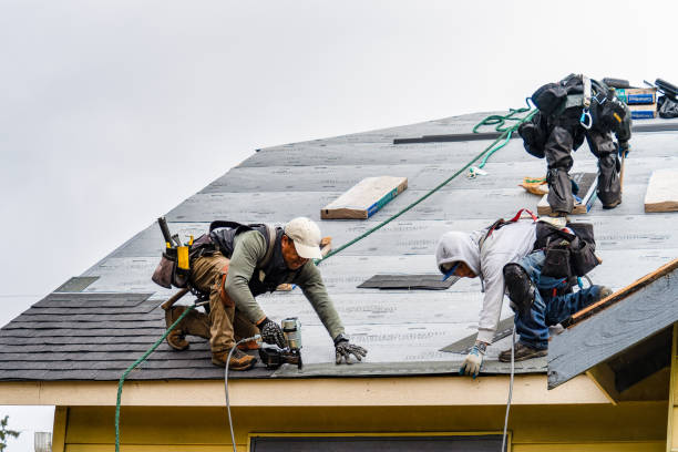 Professional Gutter Installation technician working in Rochester, WA